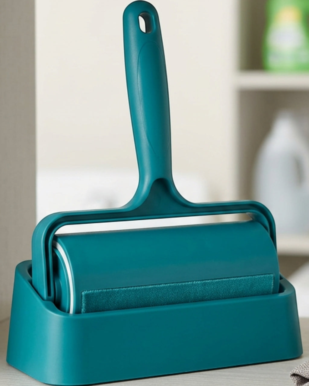 Crums Sweepdock Reusable Hair Remover Roller 7 in Teal with Base - Lifestyle view